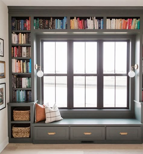 Built-In Bookshelf Frames Double-Hung Windows in Reading Nook | Pella Bench Bookshelf, Oakstone Homes, Window Seat Design, Window Bench, Office Entry, Home Library Design, Home Library, Window Seat, Home Office Design