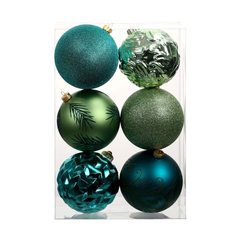 Incorporate natural materials like pinecones, burlap, and fresh greenery. Use wooden accents and handmade ornaments to bring a rustic, cozy feel to your home. A centerpiece with a mix of pine branches and berries can add warmth to your dining table. Teal Christmas Ornaments, Green And Blue Christmas Decor, Peacock Christmas Tree Ideas, Teal Christmas Decor, Peacock Christmas Decorations, Ornament Arrangement, Unique Tree Toppers, Outdoor Garland, Peacock Ornaments