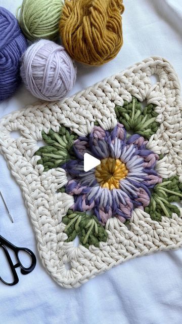 Caroline Langford - Floral Fiber Artist on Instagram: "Embroidery + crochet ✨  I’ve been wanting to experiment with embroidery in my work for a long time, and then I had the idea of combining it with a floral granny square - so here is my first attempt! I’ve already changed a couple things and I’m thinking about adding more, or possibly beads? I’m not sure yet, just taking it slow.  Thanks for all of your guesses about what this will be in the end - it’s going to be a wall hanging! 🤩  Love always, Caroline  #thehappyhomecollective #flowermacrame #floralmacrame #floralweaving #foreverflowers  #flowerweaving #handmadeisbest #etsyshop #crochetersofinstagram #floralgrannysquare #grannysquare #flowercrochet #processvideo #oddlysatsifying #flowerembroidery #paintingwithfiber" Crochet Lily Granny Square, Chenille Granny Square, Floral Granny Square Crochet, Flower Crochet Blanket, Giant Granny Square, Floral Granny Square, Cute Crochet Projects, Taking It Slow, Volume Spray