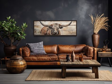 "Bring the rugged spirit of the West into your home with our \"Texas Longhorn Painted On Wood Canvas Print.\" This artwork features a striking depiction of a Texas Longhorn, rendered with the appearance of being painted directly on wood. The long horizontal format is perfect for adding a distinctive touch to the rustic decor of a cabin or cottage, or any space that appreciates the enduring appeal of Western motifs. Whether you choose to display it with a frame for a more polished look or prefer it unframed for a raw, natural aesthetic, this piece is ready to hang and will surely add character and warmth to your wall decor. USA AND EUROPE: All Canvases and all frames will ship from your own continent! USA orders are fulfilled in USA, Europe orders are fulfilled in Europe.  CANADA: OAK CANVA Western Boho Mantle Decor, Weylandts Living Room, Rustic And Luxury Decor, Chic Western Home Decor, South Dakota Chic Decor, Texas Chic Decor, Western Theme Office, Montana Homes Interiors, Western Modern Living Room