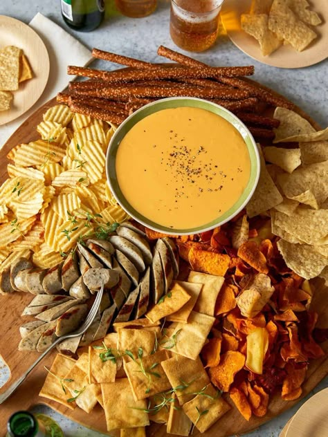 These easy crock pot dips are perfect for parties, gatherings, football games, and tailgating. Cheesy dip recipes and more! Beer Snack Board, Beer Cheese Board, Cheese Dip Charcuterie Board, Cheese Fondue Charcuterie Board, Beer Cheese Charcuterie Board, Beer Board Ideas, Beer Charcuterie Board, Beer Snacks Ideas, Crock Pot Beer Cheese Dip