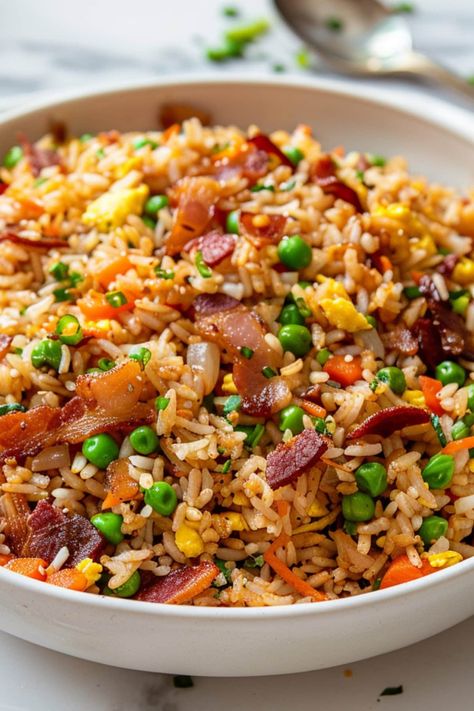 This savory bacon fried rice is packed with flavors and textures. I'm talking crispy, smoky bacon, tender vegetables, fluffy eggs, and an umami-rich sauce. Dinner Recipes Rice Bowls, Fried Rice Sides, Home Made Fried Rice, Flavored White Rice, Things To Make With Rice, Fried Rice Meals, Savory Rice Recipes, Dinner Recipes With Bacon, Dinners With Rice