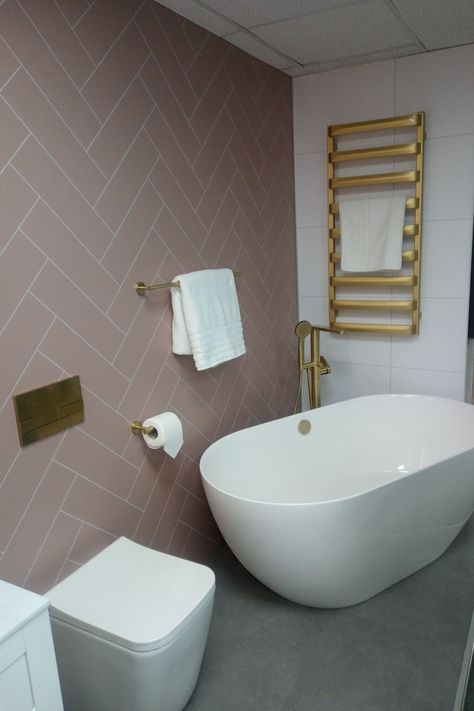 Pink to make this display pop 💗 Our Antique Rose herringbone tile-effect decor has been perfectly paired with gold fixtures to add personality and character to the space. What do you think?✨ Explore our Herringbone collection: https://bit.ly/3Zwy4XX 📸 J T Atkinson Cockermouth Pink Herringbone Bathroom, Herringbone Shower Wall, Herringbone Bathroom, Herringbone Tile Bathroom, Marble Herringbone Tile, Herringbone Tile Pattern, White Herringbone Tile, Herringbone Tiles, Marble Herringbone