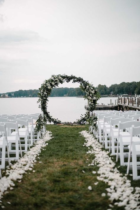 This Summer Lake wedding was intimate and romantic. Elements of the lake were on the custom stationery, as well as the details of the wedding. Neutral florals made for a bright and beautiful waterfront ceremony area that was the highlight of their wedding day. See more from this lake wedding at https://annahowedesign.com/tiffany-connor/ By The Lake Wedding, Lake Wedding Ceremony Decor, Weddings By The Lake, Weddings On The Water, On The Water Wedding, Wedding On A Lake Ideas, Lake Wedding Decorations Diy, River Side Wedding Ideas, Garden Lake Wedding