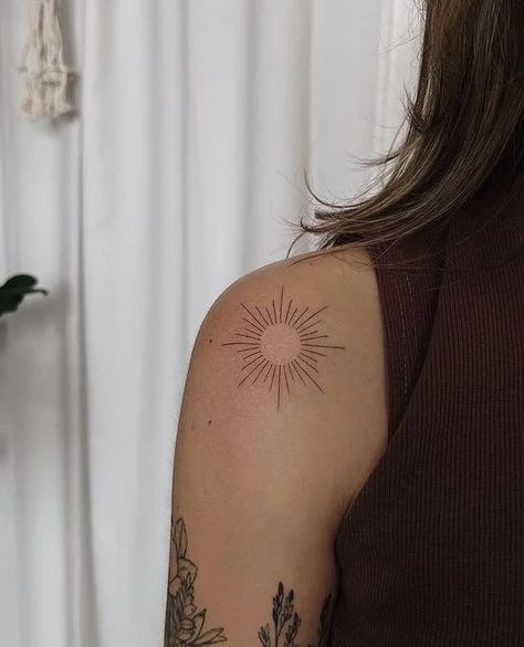 40 Gorgeous Shoulder Tattoos for Women - Body Artifact Sun Tattoo Around Elbow, Sun On Back Of Arm Tattoo, Flowers Elbow Tattoo, Sunburst Tattoo Shoulder, Sun Tattoo Shoulder For Women, Sun Woman Tattoo, Sun Back Tattoo Women, Sun Tattoo Women, Sun Shoulder Tattoos For Women