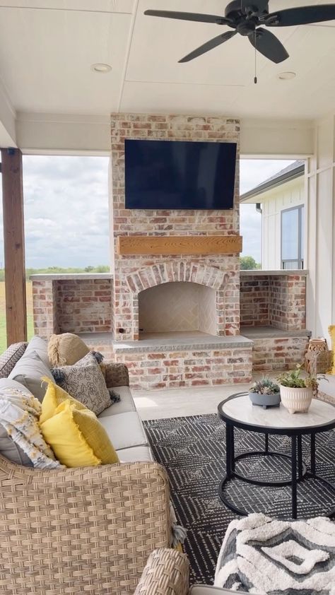 Instagram Back Porch Built In Fireplace, Back Patio Ideas With Fireplace, Simple Back Porch Fireplace, Outside Brick Fireplace, Outdoor Fireplace With Wood Boxes, Patio Fireplace Wall, Back Porch With Fireplace And Kitchen, Outdoor Fireplace With Wood Storage On Sides, Outdoor Patio Ideas Fireplace