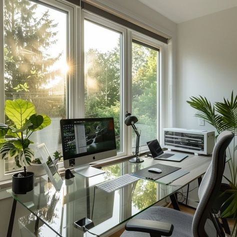 Modern home office with glass desk, dual monitors, and plants, ideal for work from home setup Home Office Ideas Glass Desk, Glass Desk Office Decor, Modern Home Office Design, Desk Office Decor, Organized Workspace, Glass Desk Office, Work Space Organization, Stay Productive, Glass Desk