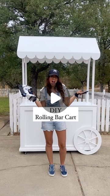 Trish 💕 Beautiful Lifestyle Blogger on Instagram: "I am so excited to share my diy bar cart!!! I used @harttoolsusa to make the cutest rolling bar cart! I love how it turned out. Using @harttoolsusa made this project go so smoothly! I only used their tools for this entire project and they were perfect for the job! My husband helped me create the design for the roof and I created the design for the bottom half! I love how it’s mobile and easy to set up and take down. I have a full tutorial coming soon!!! Let me know if you want the full tutorial??? #DoItWithHart #HARTPartner 
.
.
#girlswithtools #diy #diyprojects #project #diyproject #diypartydecor #diycraft #diycrafts #diyhomedecor #girlswhobuild #youcandoit #woodworker #powertools #walmart #partyplanner #eventplanner #partydecorations #p Diy Bar Cart For Wedding, Diy Catering Cart Plans, Diy Food Cart Ideas, Diy Party Cart With Wheels, Waffle Stall Ideas, Diy Desert Cart, Plywood Diy Ideas, Paleta Cart Diy, Bar Cart For Events