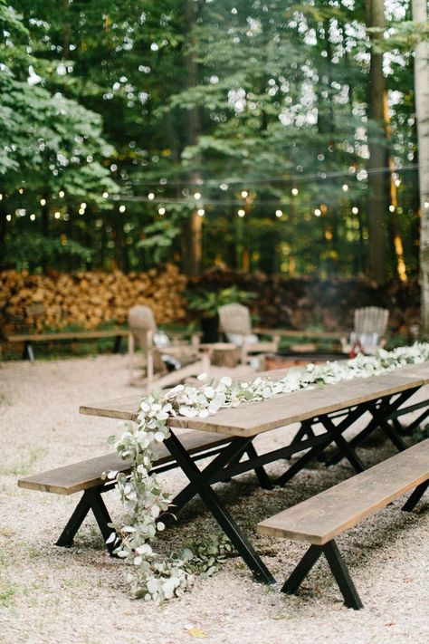 Picnic tables draped with floral garlands and twinkle lights are perfect for an outdoor wedding reception.  #love #inspiration #diy #wedding #decorgoals #ideas Picnic Table Wedding, Outdoor Lights Ideas, Diy Outdoor Lights, Outdoor Wedding Cake, Wedding Cake Display, Diy Outdoor Weddings, Wooden Benches, Wedding Lounge, Wedding Decorations Ideas