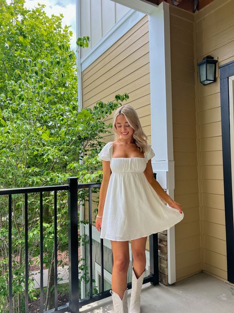 Sundress And Cowboy Boots Outfit, Hoco Dresses With Cowgirl Boots, Hoco Cowgirl Boots, All White Cowboy Boots Outfit, Dresses With White Cowgirl Boots, White Western Dresses, White Concert Dress, Cowgirl Homecoming Dresses, White Dresses With Cowboy Boots