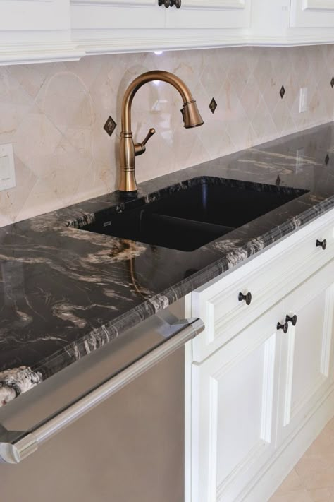 Titanium Granite Countertops from Brazil is filled with movement of blacks, golds, creams and ivory.  #black #granite #countertops Mediterranean Kitchen Cabinets, Black Countertops White Cabinets, Granite Benchtop, Kitchen Black Counter, Gold Granite Countertops, Titanium Granite, Counter Top Ideas, Countertops White Cabinets, Granite Bathroom Countertops