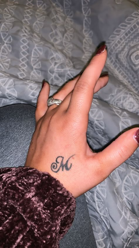 letter “M” hand tattoo #cute #handtattoo Hand Letter Tattoos For Women, The Letter M Tattoo Ideas, Letter Hand Tattoos For Women, Hand Tattoos Initials, Letter M Tattoo Ideas Initials, Tatoos Woman Hand Name, Hand Tattoos Names, Letter On Hand Tattoo, M Hand Tattoo