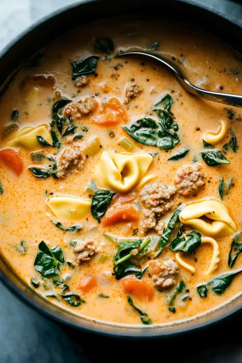 Creamy sausage tortellini soup is a hearty mix of Italian sausage, cheese tortellini, fresh spinach, and rich broth. It's the perfect cozy meal for fall. Creamy Sausage Cheese Tortellini Soup, Italian Sausage Recipes With Tortellini, 30 Minute One Pot Creamy Italian Sausage Tortellini Soup, Slow Cooker Sausage And Tortellini Soup, The Best Tortellini Soup, Fall Healthy Crockpot Meals, Creamy Sausage Spinach Tortellini Soup, Italian Sausage Spinach Tortellini Soup, Creamy Sausage Tortellini Soup With Sweet Potato