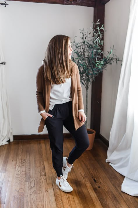 5 ways to style black joggers. Sneakers And Joggers Outfit, Womens Joggers Outfit Dressy Work, Black Jogger Travel Outfit, Joggers With Cardigan Outfit, Tan Athletic Pants Outfit, Women Black Joggers Outfit, Thanksgiving Jogger Outfit, What To Wear With Black Joggers Casual, Black Joggers Travel Outfit