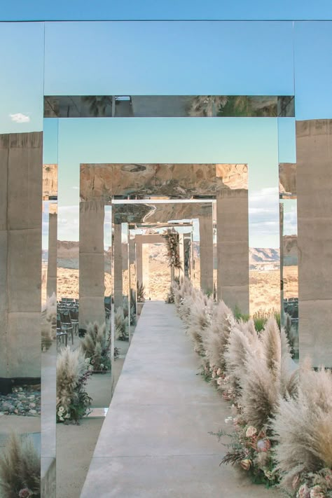 Desert weddings are trending and we can't get enough of them. See 11 desert wedding ideas that are anything but sparse. Mirror Wedding Arch, Desert Florals, Mirror Arch, Desert Wedding Ideas, Desert Party, Utah Desert, Desert Oasis, Desert Wedding, Outdoor Weddings