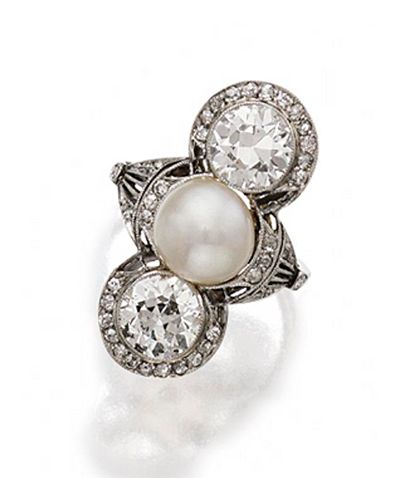 DIAMOND AND PEARL RING, CIRCA 1910.  The vertical motif set in the center with a button pearl of approximately 8.7 mm., bordered by 2 old European-cut diamonds weighing approximately 1.20 and 1.30 carats, framed by small single-cut and rose-cut diamonds, mounted in platinum Diamond And Pearl Ring, Water Gems, Antique Jewelry Box, Edwardian Jewelry, Jewels Rings, Art Nouveau Jewelry, Amethyst Purple, Fabulous Jewelry, Art Deco Jewelry