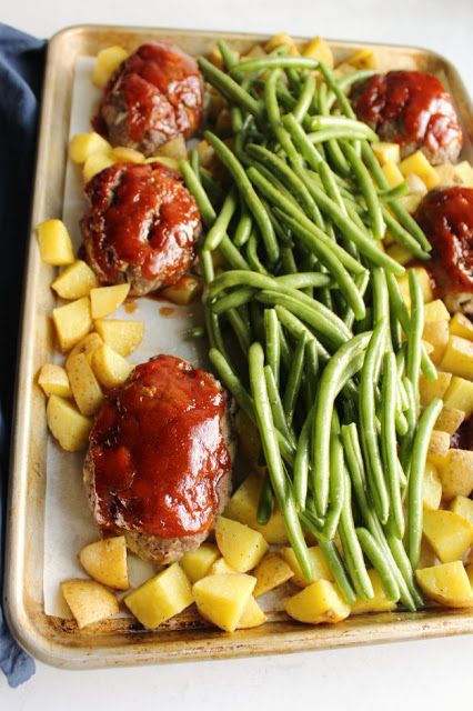 Make your whole homestyle meal on one sheet pan. Everyone can enjoy their own mini meatloaf along with roasted green beans and potatoes and there's only one pan to clean! Sheet Pan Meatloaf And Green Beans, Sheet Pan Meatballs And Veggies, Ground Beef Potatoes Green Beans, Sheet Pan Meatloaf Recipes, Sheet Pan Mini Meatloaf, Fast Supper Ideas With Ground Beef, Sheet Pan Mini Meatloaves, Mini Meatloaf Sheet Pan Dinner, Pork Sheet Pan Dinner