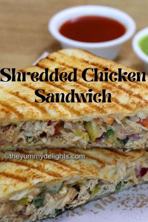 close-up of shredded chicken sandwich stacked on a board. Cheesy Shredded Chicken, Chicken Sandwich Filling, Chicken Mayonnaise, Easy Chicken Sandwich, Sandwich Recipe Videos, Chicken Mayo, Shredded Chicken Sandwiches, Grilled Sandwich Recipe, Chicken Breast Sandwich