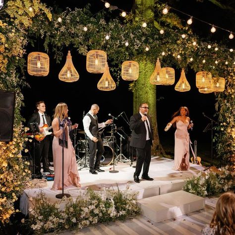 Kaytee Stice | Wedding Florist on Instagram: "There’s nothing quite like dancing under starlight. When the band starts the sounds of revelry begin! Planning + Design: @annaluciaevents Lighting: @jmeventgroup Dance Floor Wrap: @paradisegraphix Photo: @hunterryanphoto Entertainment: @aragonartists Floral Design: @rootsfloraldesign" Dance Floor Hanging Decor, Dancefloor Wedding Ideas, Wedding Dance Floor Decorations, Dance Floor Outside, Wedding Dance Floor Design, Photo Stand Wedding, Tent Dance Floor, Romantic Courtyard, Starlight Wedding