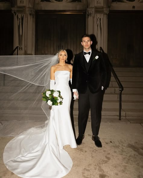 Oh just #RebeccasBride @al__dobro and her husband Tim looking like they belong on the COVER OF VOGUE 🤩👏 We can’t get enough of this absolutely stunning wedding! Love how Alexandria styled her strapless mikado mermaid dress with the bow, the long gloves, and the horsehair trimmed long veil 🙌Timeless perfection (also we’re getting iconic Elizabeth James vibes, iykyk 🥰) Congrats to these newlyweds! 🥂 Photos: @oliveandfigproductions Dress: @maggiesotterodesigns Veil: @ansoniabridalveils Gl... Strapless Timeless Wedding Dress, Strapless Wedding Dress Long Train, Wedding Dress With Silk Gloves, Made With Love Lily, Strapless Wedding Dress Gloves, Wedding Dresses With Long Gloves, Strapless Wedding Dress Veil, Off Shoulder Wedding Dress With Gloves, Long Veil Wedding Photos