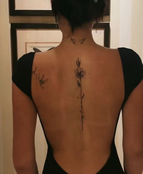 Boho Tattoos Spine, Spine Tattoos Minimalist, Birth Flowers Spine Tattoo, Brazil Inspired Tattoo, Spine Tattoos For Women With Cross, Spine Tattoos For Women Cross, Flower Back Tattoo Spine, Fine Line Tattoo Spine, Back Tattoo Flower