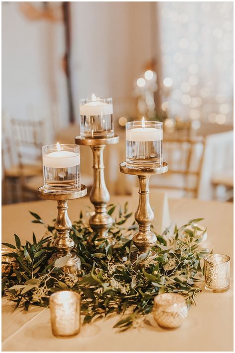 Bronze Centerpieces Wedding, Gold Accent Centerpiece, Gold Candle Wedding Centerpieces, Rustic Gold Wedding Decor, White And Bronze Wedding Decor, Trendy Wedding Centerpieces, Gold Candle Stick Centerpieces, Candle And Flower Wedding Centerpieces, Simple Candlestick Centerpieces Wedding