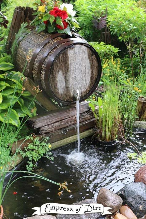 Wooden barrel waterfall over a backyard garden pond. Come see more creative pond ideas. #waterfall #DIY #empressofdirt Kolam Air, Taman Air, Garden Water Features, Backyard Ponds, Fountains Backyard, Backyard Pond, Garden Ponds, Garden Waterfall, Pond Waterfall