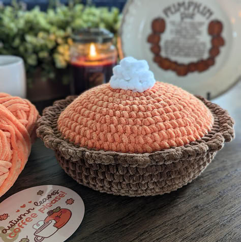 if you enjoy crocheting plushies, you'll love this pumpkin pie free crochet pattern. This crochet food can be used for a pillow, or you can add it to your plush collection. Pumpkin Pie Pillow, Pumpkin Pie Crochet Pattern Free, Crochet Pumpkin Pie Pillow, Pumpkin Pie Crochet Pattern, Cute Crochet Pumpkin, Fall Crochet Projects Ideas, Crochet Pumpkin Pie Free Pattern, Pumpkin Spice Crochet, Crochet Pumpkin Spice Latte