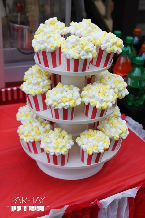 Circus birthday party feature Drive In Movie Party, Popcorn Cupcakes, Circus Birthday Party Theme, Movie Night Birthday, Party Popcorn, Night Birthday Party, Carnival Birthday Party Theme, Movie Night Birthday Party, Movie Birthday Party