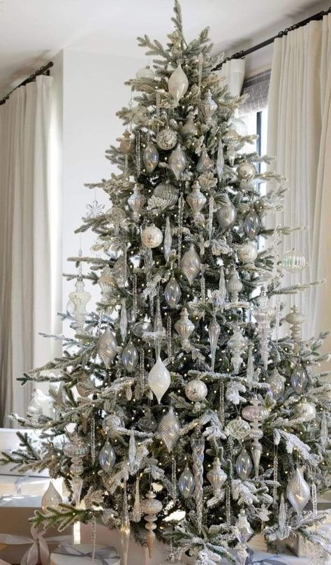 Flocked Christmas Tree With Icicles, Silver White Tree Christmas, Flocked Tree Christmas Decor, White Silver Crystal Christmas Tree, White Silver And Green Christmas Tree, White And Metallic Christmas Tree, Crystal Decorated Christmas Trees, White And Crystal Christmas Tree, White Crystal Christmas Tree