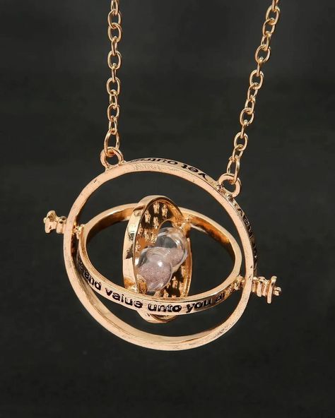 Turn back time with the iconic Time-Turner necklace ⏳✨. A symbol of magic and mystery, this Harry Potter accessory is perfect for those who wish to relive every magical moment. #HarryPotter #TimeTurner #MagicalJewelry Spinning Jewelry, Time Turner Necklace, Hourglass Pendant, Time Necklace, Time Turner, Golden Pendant, Magical Accessories, Sigil Magic, Sweater Chain