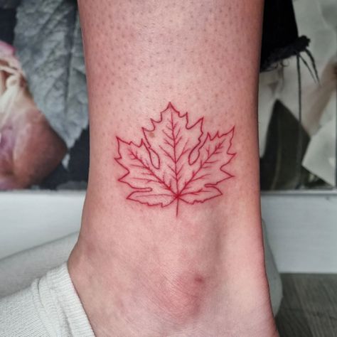 A simple, basic, red outline maple leaf tattoo can be applied to your ankle. It's also a fantastic choice for folks who dislike large tattoos. A little maple leaf in a basic style will look nice practically anywhere on your... Red Maple Leaf Tattoo, Red Leaf Tattoo, Maple Tattoo, Leave Tattoo, Red Outline, Red Maple Leaf, Leaf Tattoo, Ankle Tattoos, Red Maple