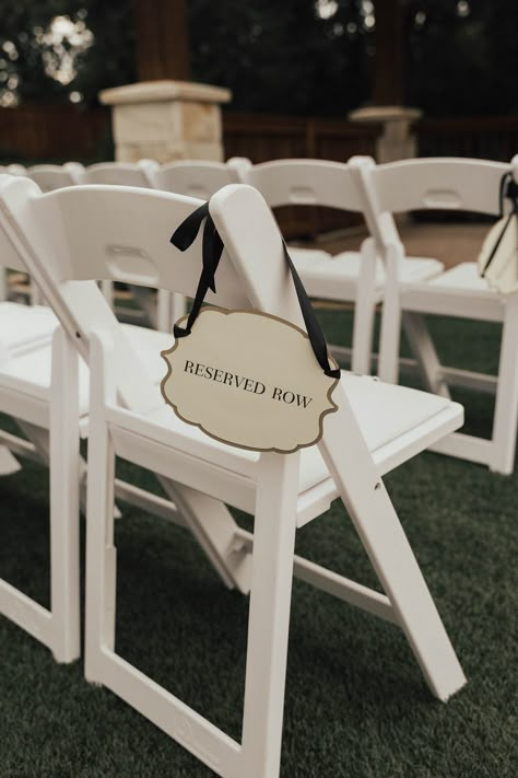 | classy reserved row wedding ceremony signs | outdoor wedding ceremony sign ideas | wedding ceremony ideas | ways to reserve the front rows of your wedding ceremony | wedding ideas | wedding tips | outdoor wedding ceremony | photo taken at THE SPRINGS Event Venue. follow this pin to our website for more information, or to book your free tour! SPRINGS location: Norman, OK photographer:  Hannah Nichols Photography #weddingceremony #outdoorwedding #weddingday #weddingideas #weddinginspiration #okc How To Reserve Seats At Wedding Ceremony, Reserved Ceremony Signs, Reserved Rows At Wedding, Outdoor Wedding Ceremony White Chairs, Wedding Aisle Reserved Sign, Row Reserved Sign Wedding, Reserved Chair Signs Wedding, Wedding Chair Reserved Signs, Resevered Seating Wedding Ceremony