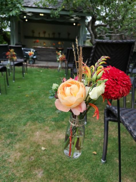 Cream Lisianthus, Milk Bottle Flowers, Hanging Bottles, Outdoor Ceremony Ideas, Outdoor Wedding Aisle, Red Dahlias, Wedding Aisle Outdoor, Peach Garden, Bottle Flowers