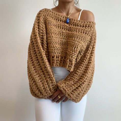 **READY TO SHIP** 📦 Chunky Super SOOOFFFFTTTT Crochet Crop Sweater Boho Relax Fit Off the Shoulder Crop Sweater The perfect sweater to throw on after a yoga / gym session to do errands Layer over a dress for cooler weather Super cute beach cover for breezy days Size : Large to Extra Large Approximate measurements 📐 Cuff to Cuff : 60 inches Top to Bottom : 14 inches Chest : 60 inches Colors : Golden Brown 🧶 Stitch by Stitch teaches patience and appreciation 100% HANDMADE by yours truly in a smoke free and pet free home studio Thank you for stopping by today! Many hugs ☺️ KeKe Please feel free to message me for more colors and sizes Custom Order ( please allow 1 week before shipping ) Care: Hand wash cold and air dry Vegan friendly. Perfect for those allergic to animal fibers Crochet Hollow Out Sweater, Chunky Crochet Crop Top, Crotchet Chunky Sweater, Off Shoulder Knitted Sweater, Handmade Crochet Sweater, Crochet Baggy Sweater Pattern Free, Crochet Sweater Chunky Yarn, Crochet Sweater Cropped, Off Shoulder Crochet Sweater