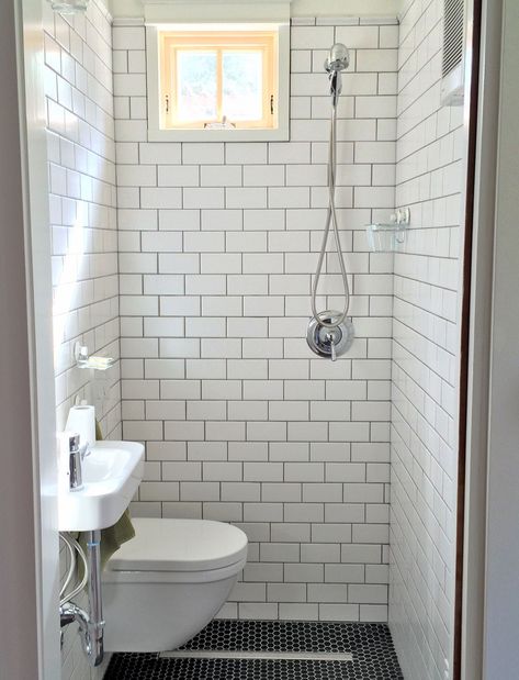 tiny bathroom, wall hung toilet and sink, subway tile, black hex floor tile, strip drain, compact modern bathroom Wet Bathroom Ideas, Tiny House Shower, Tiny Shower Room, Tiny Wet Room, Small Narrow Bathroom, Small Wet Room, Wet Bathroom, Small Shower Room, Wet Room Bathroom