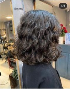 "Unveiling the magic in black strands adorned with subtle strokes of radiance. ✨ #BlackHairEnchantment" Short Wavy Haircuts For Thick Hair, Lob Naturally Curly Hair, Short Hair For Wavy Hair Naturally Curly, Short Waves Hair, Naturally Wavy Long Bob, Curly Perm Short Hair, Unstyled Wavy Hair, Short Haircuts For Wavy Curly Hair, Digital Perm Short Hair Shoulder Length