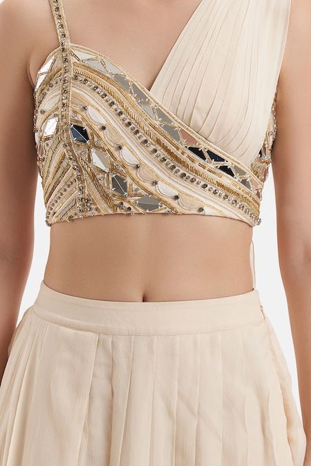 Buy Ivory Chiffon Hand Embroidered Mirror Asymmetric Neck Blouse And Skirt Set For Women by Divya Aggarwal Online at Aza Fashions. Draped Blouse Pattern, Mirror Work Choli, Thread Work Blouse Designs, Mirror Beads, Trendy Outfits Indian, Lehenga Designs Simple, Latest Model Blouse Designs, Fashionable Saree Blouse Designs, Padded Blouse