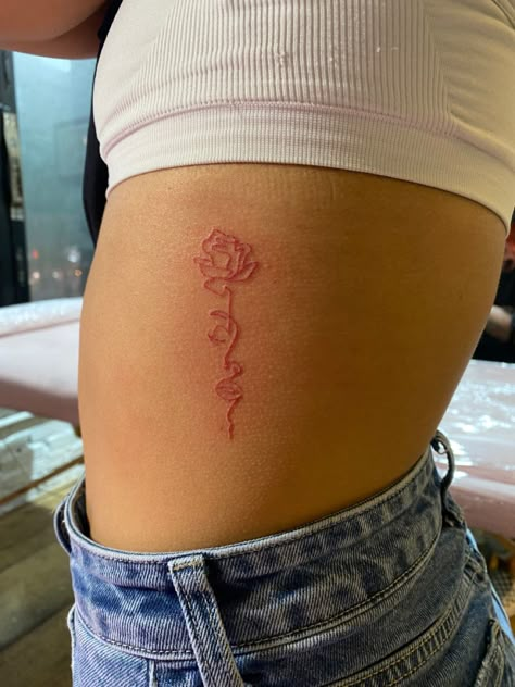 Red Dainty Tattoos For Women, Red Simple Tattoos, Red Rib Tattoos For Women, Cute Tattoos Ribs, Delicate Rib Tattoo, Red Tattoo On Hip, Red Ink Side Tattoo, Red Ribcage Tattoo, Hip Tattoos Women Red Ink