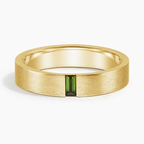 Men's 18K Yellow Gold Apollo Green Tourmaline 4.5mm Wedding Ring. This modern wedding band features a vertical baguette green tourmaline set in a matte brushed finish for a defining look. The softened inside edge provides increased comfort for daily wear. Men’s Wedding Bands With Stones, Men’s Wedding Band With Emerald, Gold Engagement Ring Silver Wedding Band, Mens Wedding Bands Simple, Marriage Ring Men, Men Ring With Diamond, Mens Wedding Bands With Stones, Mens Peridot Ring, Amethyst Wedding Rings For Men