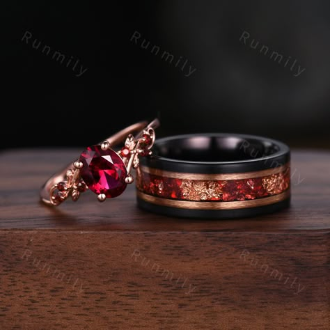 Here we have a Oval cut Ruby couples ring set rose gold matching promise ring His and Her wedding band Mens gold leaf tungsten ring anniversary gifts ITEM DESCRIPTION ✦ Handmade, high-quality item! ✦ Material: Sterling Silver/Solid Gold/Tungsten ►Sold as a two-piece set ►His ring is Black Tungsten Carbide with rose gold leaf and ruby inlay. ►His band width: 8mm ►His tungsten ring will not turn green itself and will not cause your skin to turn green.  ✦ Durable - Incredibly Scratch-Resistant to a Matching Ring Sets, Wedding Rings Ruby Men, Ruby Engagement Ring Men, Wedding Rings Him And Her, Garnet Wedding Band Men, Ruby Wedding Rings Men, Non Traditional Wedding Rings Men, Engagement Bands Men, His And Hers Engagement Rings