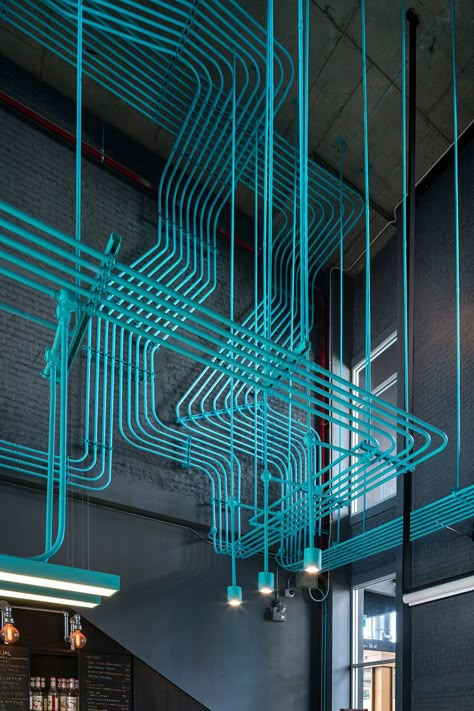 Interior Decor Idea - Turquoise electrical conduit is a design feature running through this co-working office space. Exposed Ceilings, Storyboard Ideas, Electrical Conduit, Coworking Office, Space Interiors, Coworking Space, Office Interior, Office Interior Design, Commercial Design