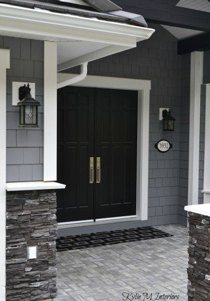 exterior of home with chelsea gray painted shakes, black painted double front door and white trim with dark charcoal ledgestone Grey Exterior House Colors, Black Front Door, Gray House Exterior, Best Exterior Paint, House Paint Color Combination, Black Shutters, Gray House, Black Front Doors, Exterior House Paint Color Combinations