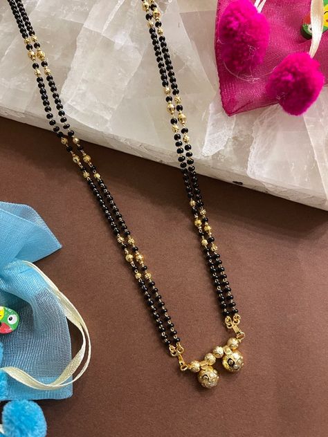 A black bead necklace is supposed to keep negative energy away. Select black beaded necklaces from our gold jewellery collection. Black Beads Designs Latest, Chain Mangalsutra Designs, Diamond Ornaments, Diamond Jewellery Designs, Gold Jewellery Collection, Mangal Sutra, Black Beads Mangalsutra Design, Mangalsutra Design, Black Gold Chain