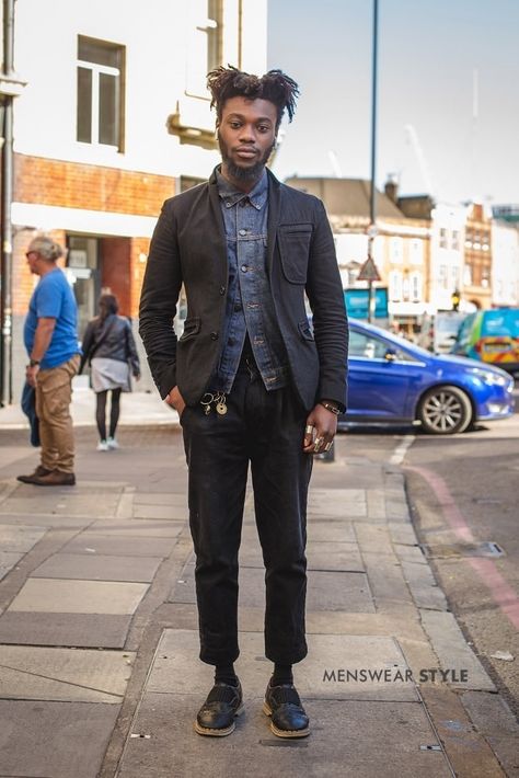 This is Kouadio on the streets of London in 202 wearing Black Brogues, Cropped Rolled Chinos, Denim Jacket, and Navy Wool Blazer. Black Denim Jacket Street Style, Black Brogue Boots For Fall, Black Cotton Blazer For Streetwear, Fitted Selvedge Denim Jacket For Streetwear, Casual Selvedge Denim Jacket For Streetwear, Men's Street Style Photography, Black Brogues, Blazer Street Style, Cool Kids Clothes