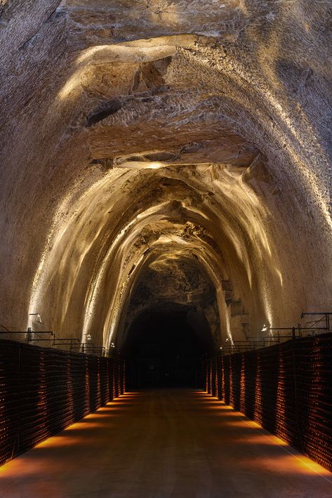 Caves Champagne Joseph Perrier - L&L Luce&Light Parisian Lighting, Illusion Architecture, Cave Architecture, Cave Aesthetic, Champagne France, Covered Walkway, Architectural Lighting Design, Corridor Lighting, Outdoor Projector