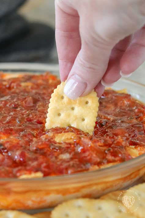 Pepper Jelly Cheese Dip is a warm appetizer served with butter crackers! This easy appetizer recipe uses simple ingredients that have the best flavor when combined. Red Pepper Jelly Recipe Dip, Valentine Party Dips, Boursin Pepper Jelly Dip, Red Pepper Jelly Dip Appetizer Recipes, Hot Jelly Cream Cheese Dip, Hot Pepper Jelly Dip With Bacon, Hot Pepper Jelly Cream Cheese Dip, Valentines Recipes Appetizers, Whipped Boursin And Pepper Jelly Dip