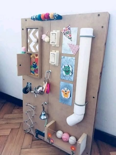 Preschool Busy Board, Outdoor Sensory Board, Busy Wall For Toddlers Diy, Diy Baby Sensory Board, How To Make A Busy Board, Sensory Boards Diy, Activity Board For Babies, Sensory Boards For Toddlers Diy, Busy Boards For Babies