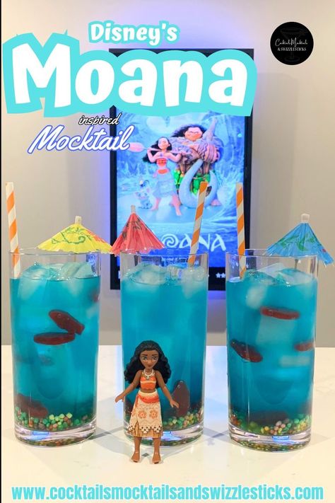 this image shows three blue drinks with nerds candy on the bottom, swedish fish thoughout, cocktail umbrellas and orange and white striped straws in front of a Moana movie poster with a Moana character in front of them. Disney Themed Drinks, Moana Movie Night, Disney Movie Themed Dinner, Family Movie Night Themes, Disney Movie Night Menu, Disney Themed Movie Night, Disney Movie Night Food, Themed Movie Night, Disney Movie Night Dinner