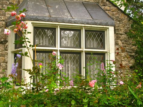 Diamond paned windows on fairytale cottage.  Doesn't get any better.  :) Cottage Windows, Leaded Glass Windows, Tudor Style Homes, Fairytale Cottage, Storybook Cottage, Cottage Exterior, Cottage By The Sea, Bay Windows, Window Seats